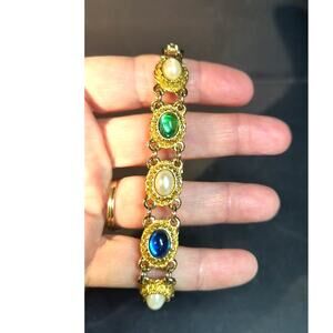 1116.  Gold Tone Jeweled Bracelet